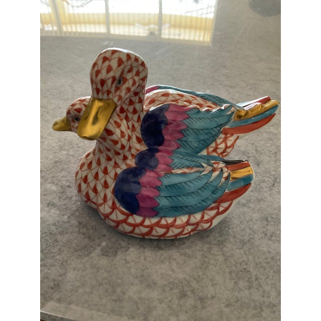 Herend Rust Fishnet pair of hand painted ducks figurines measuring 2.75" x 4.25" x 3". The beaks, webbed foot , and...