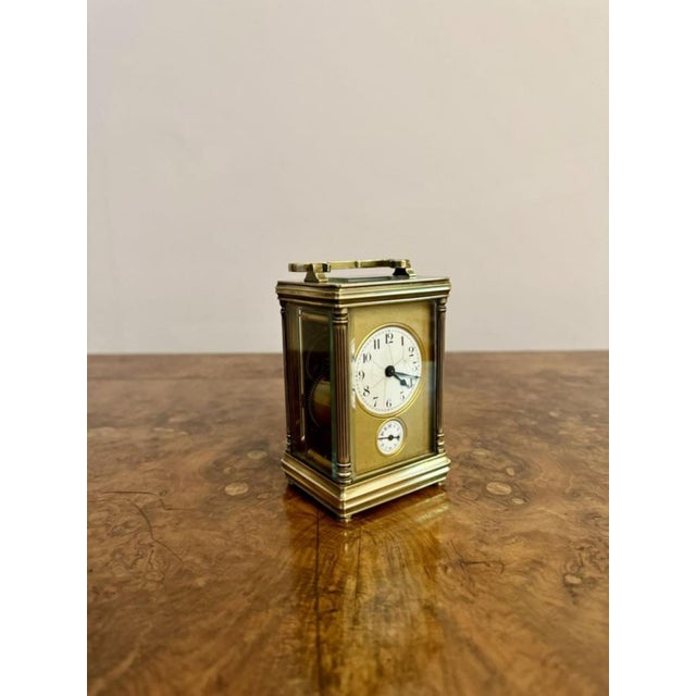 Antique Victorian quality brass carriage clock with an alarm having a quality antique Victorian brass carriage clock with...