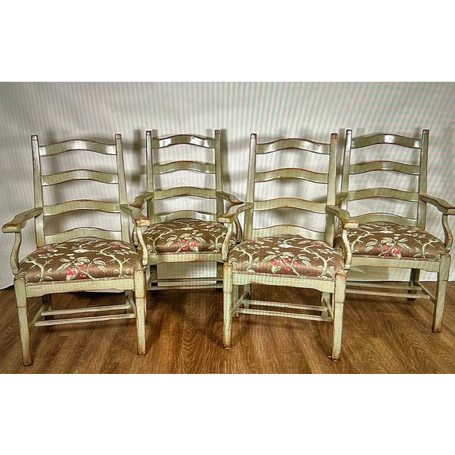 An exquisite set of (4) Attributed to Woodland Furniture Ladderback Arm Chairs. Benchmade, and designed with a contour...