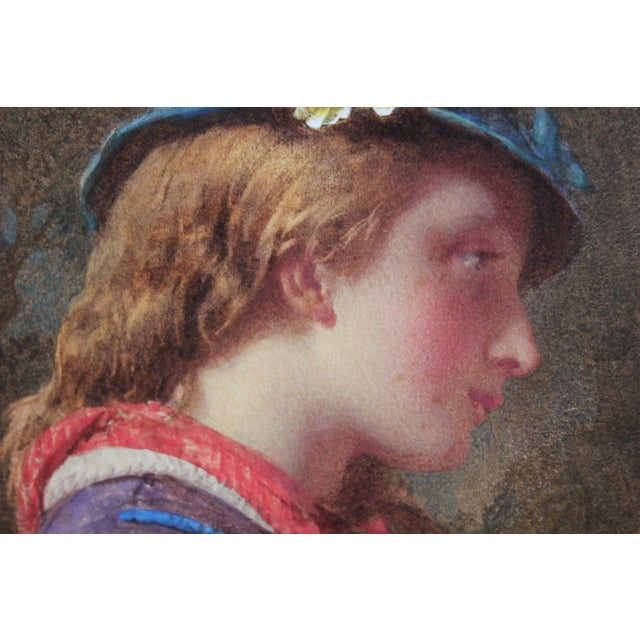 Watercolor profile portrait of a young girl in a blue fascinator hat and a red scarf by artist Henry LeJeune in the pre-...