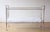 Well-maintained children's bed made of tubular steel with airy mesh sides and a woven headboard and footboard. Very good...