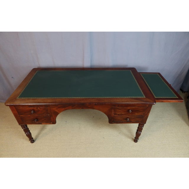 Large double-sided desk with four drawers on each side and two pull-out slides. Good overall condition with minor signs of...
