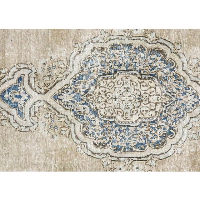 1940s Persian Kerman Rug. Hand woven in the Kerman region of Iran. Distressed and refinished in the U.S. The Persian...