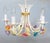 A gorgeous vintage Mid-20th century Italian tole five-arm floral chandelier. This charming hand painted chandelier has...