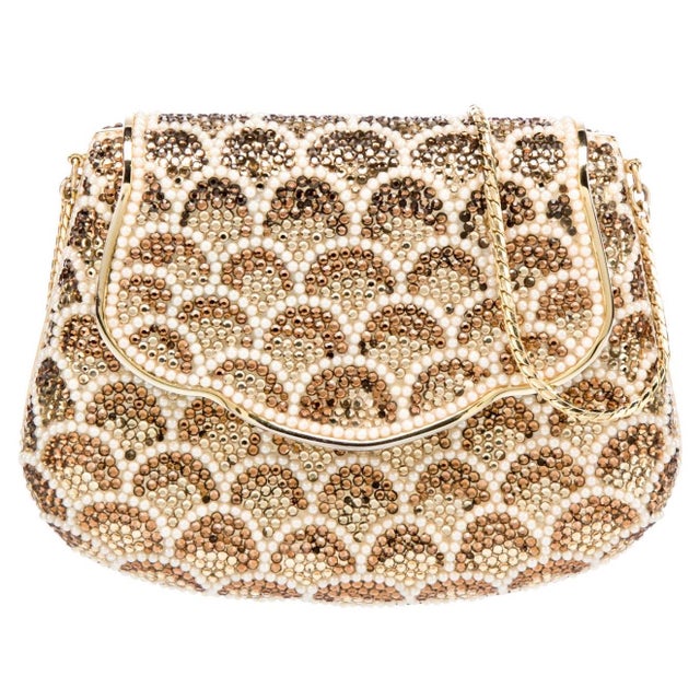 Judith Leiber “Carry Secrets” shoulder bag in a curved saddle shape, embellished crystals in tones of brown, gold and...