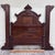This is a stunning full size antique Monumental Victorian Renaissance Revival walnut and burl wood bed, circa 1880s,...