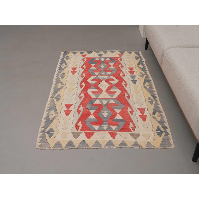 Vintage Hand-Knotted area rug is a semi-antique vintage area rug. The '70s Eastern region of Anatolia's unique rug is...