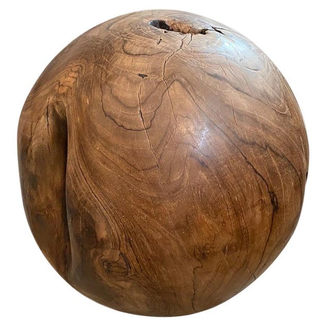 Natural teak wood root sphere. The outer section is polished and the inner root left smooth in contrast. We have a...