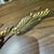 Pair of older acanthus leaves curtain tie backs made from a gilded metal. There are some dark spots and some pitting on...