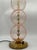 A pair of vintage table lamps, featuring a vertical structure composed of three spherical elements in slightly pinkish...