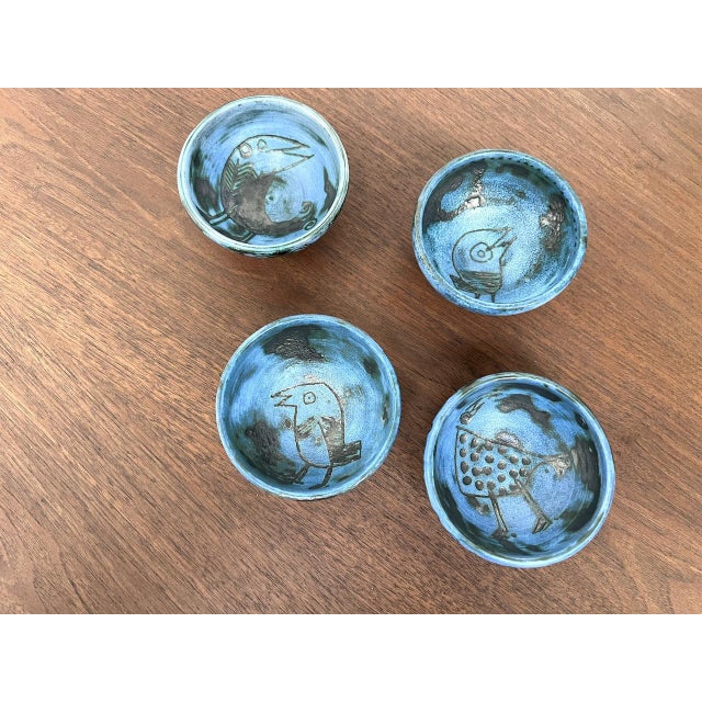 Maison Lecan presents this set of four earthenware bowls by Jacques Blin, decorated with incised birds, with a partially...