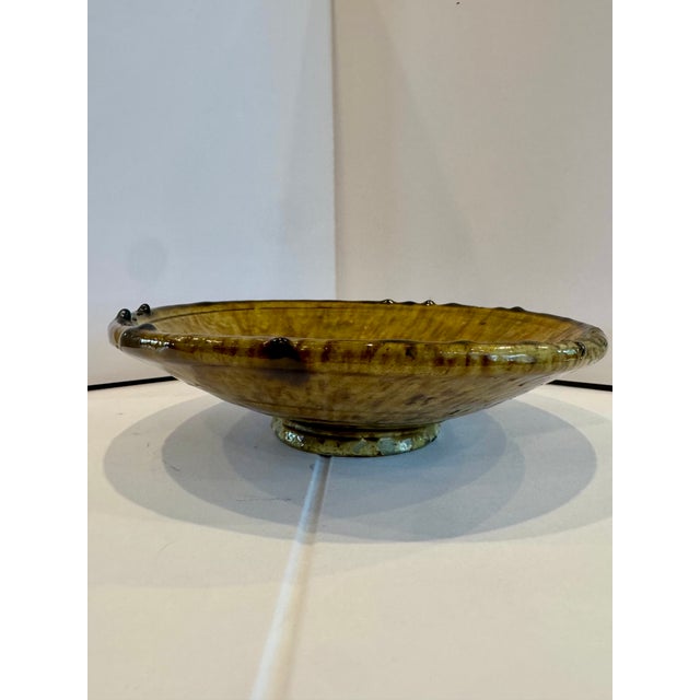 Beautiful handmade ceramic Moroccan serving bowl, sort of a mushroom brown color but with shades of green and yellow as...