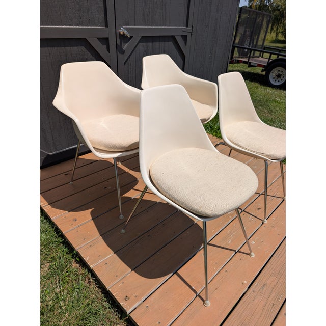Elevate your dining space with this stunning set of four vintage Burke fiberglass chairs. Proudly manufactured by Burke,...