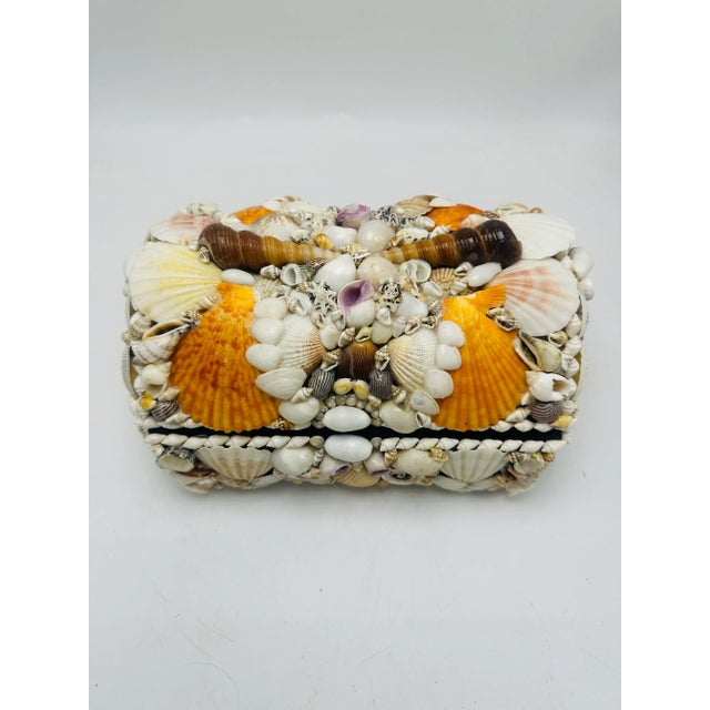 Lovely vintage shell box. This handmade box has a beautiful assortment of shells, carefully placed. Velvet lined interior