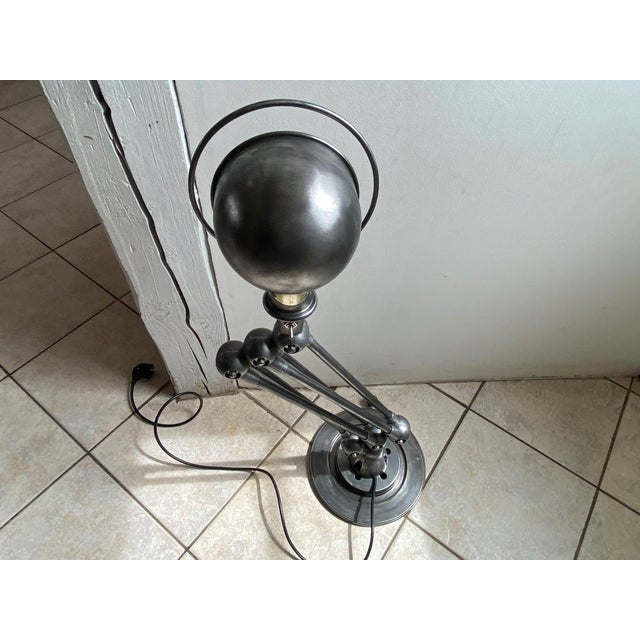 Authentic and old Jieldé floor lamp composed of five 40cm arms. Lamp completely stripped, brushed, coated with an anti-...