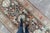 A delightful Oushak rug features a variety of intermingling designs such as florals, vase, and abstract medallions to...