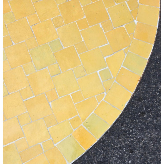 Beautiful handcrafted Moroccan mosaic table featuring an elegant yellow color palette. Measuring 40 inches in diameter,...