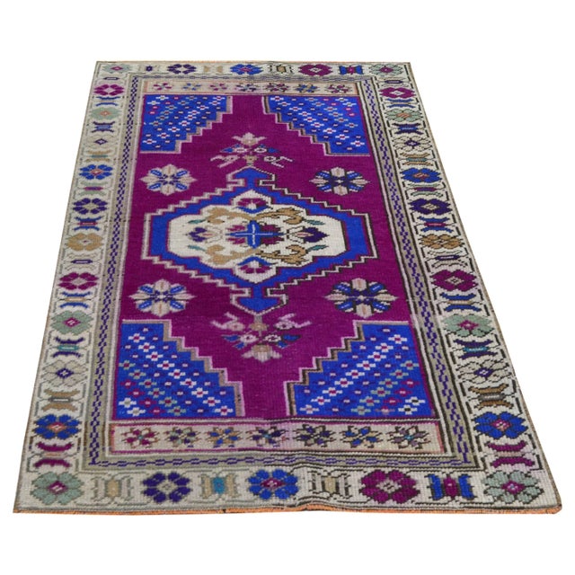 Hand-knotted with care using traditional rug making techniques, this wool rug blends timeless craftsmanship with a modern...