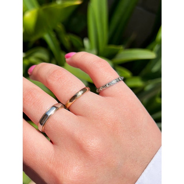 About This Ring: This antique 18KT gold wedding band carries a heartfelt inscription: “F.B.M. from H.A.H Feb 2, 1907.” Its...