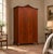 A 1950s double wardrobe with beautifully figured bookmatched mahogany doors, fine line inlay, an ornate central escutcheon...