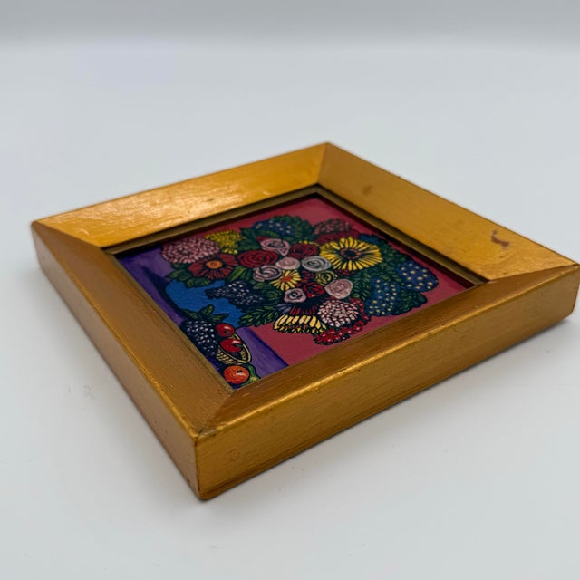 Small in scale but exuberant in color, this vintage floral still life features a densely layered bouquet of stylized...