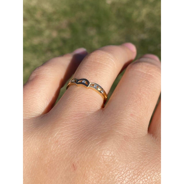 The Moda: Mid Century Modern Yellow Gold and Natural Diamond Ring. This elegant ring showcases a central half-moon channel...