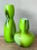 Elevate your decor with this stunning set of two vintage Boho art glass vases, each a vibrant testament to mid-century...