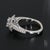This is a 14k White Gold Ring with a European Shank Mounting & One 6.1mm Round Center Stone, Surrounded by Twenty-six...