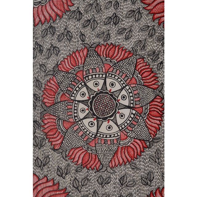 The artwork features a highly symmetric, circular center layout composed of stylized Matsya (Fish) facing an intricate...