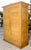 This majestic two-door wardrobe in solid fir wood, dating back to the 19th century in Italy, is a true antique that...