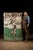 1930s; Vintage porcelain enamel single‑sided roadside sign reading "Play GOLF at Virginia" with swinging golfer graphic in...