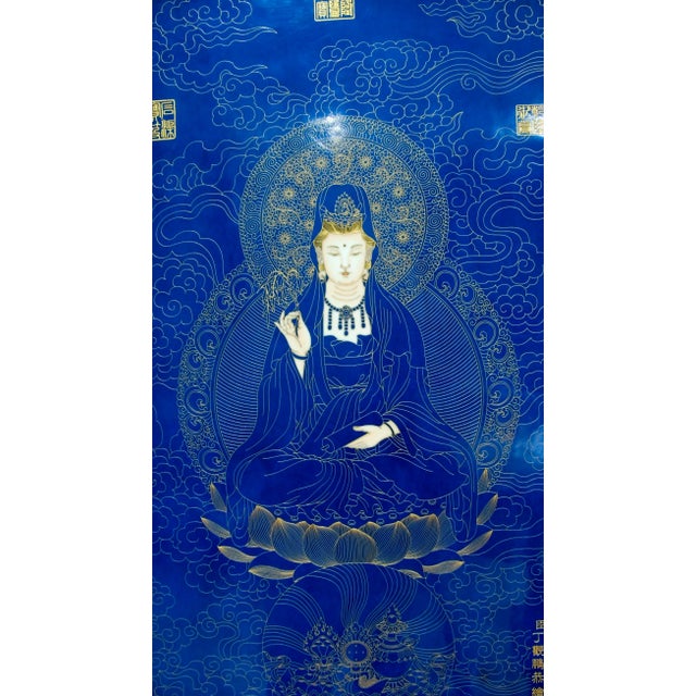 Chinese framed porcelain Buddhist temple plaque, Kuan Yin with Buddhist symbols, seated on a finely detailed, lotus throne...