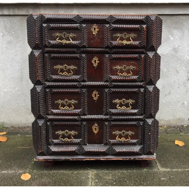 - Tramp or Folk Art chest of four drawers - Carved in the characteristic pyramid pattern and ornate shaped - Signed to the...