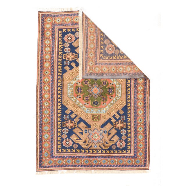 Fine vintage hand-knotted Persian Ardebil rug with a large geometric medallion centered on a dark blue field. The design...