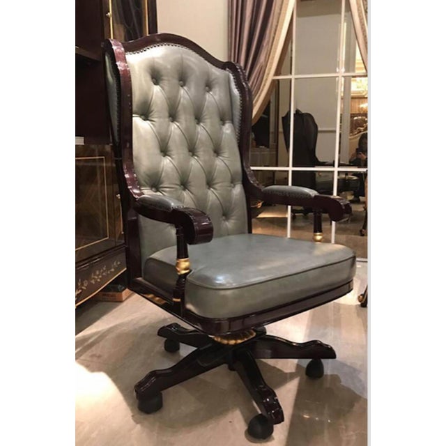 Commanding and sophisticated, this high-back executive chair brings timeless elegance to a home office, library, or...