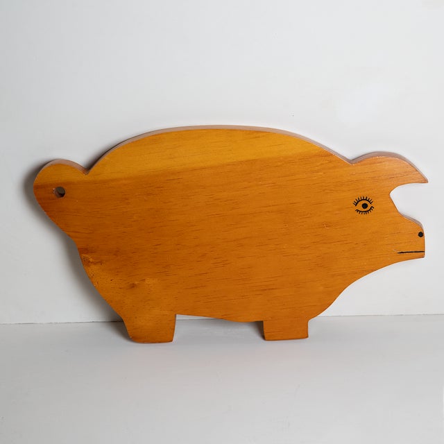 Charming hand painted pig-shaped serving board, carved from pine wood.