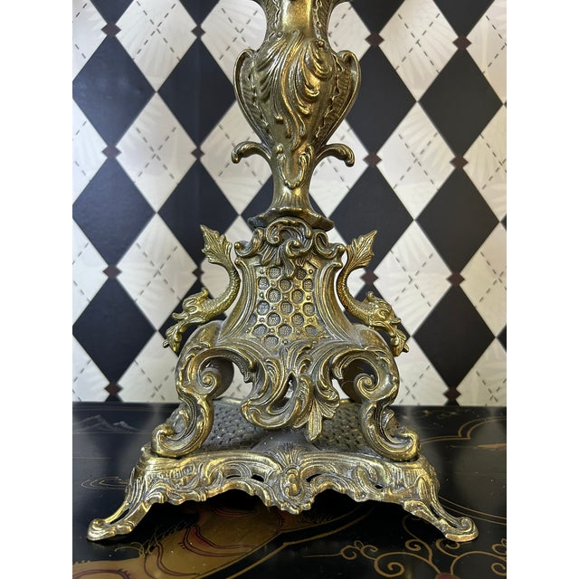Pair of monumental brass candelabra in the Rococo Revival taste, featuring elaborate scrolling arms, pierced decoration,...