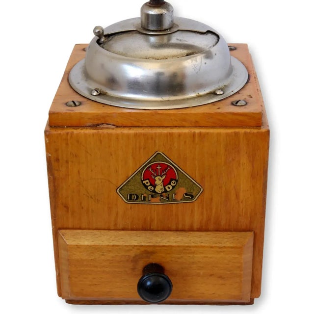 Charming mid-century Dutch coffee grinder by Dienes PeDe, circa 1950s. Crafted from warm beechwood with a polished metal...