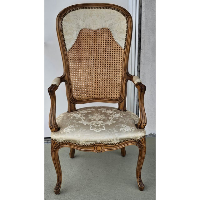 Italian made Louis XV Style Brass Nail Studded, Caned and Partial Upholstered Fauteuil. Double cane back with extra wood...