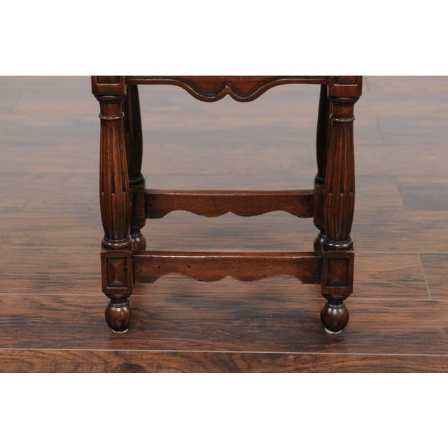 An Italian petite carved walnut side table with single drawer, geometrical motifs, unusual fluted legs and side stretchers...