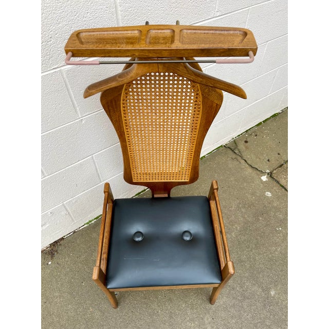 Beautiful walnut valet chair with change/trinket tray and storage underneath the seat. The wood and caning are in...