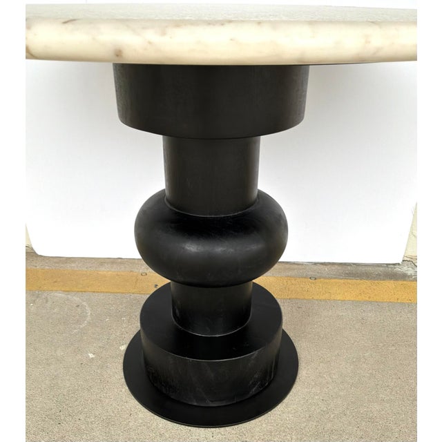 Original retail $2380, stylish Arteriors White Marble Devitio End Table, turned wood ebony finished pedestal, bronze base,...