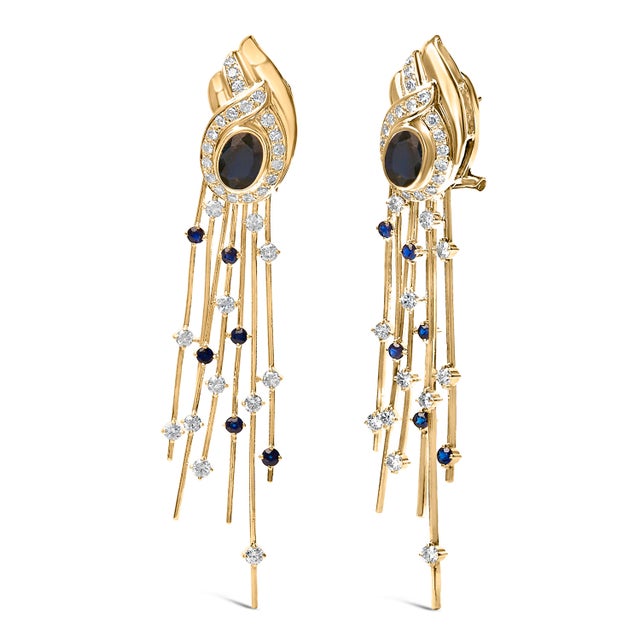 Indulge in the regal elegance of these stunning chandelier earrings, masterfully crafted from radiant 14K yellow gold....