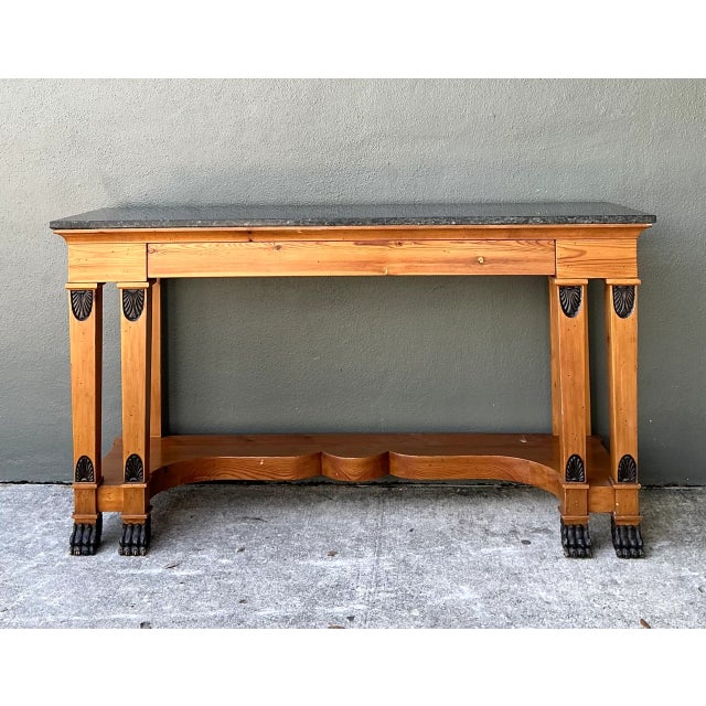 Exemplifying refined architectural craftsmanship, this vintage console table by William Switzer features a heavy, dark...