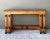 Exemplifying refined architectural craftsmanship, this vintage console table by William Switzer features a heavy, dark...