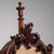 This 19th century screen from United Kingdom is finished in brown and green, worked in wood. Its carved detailing gives...