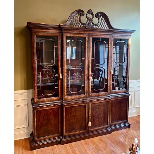 This high quality beautifully maintained china cabinet is a registered piece from the Drexel Heritage Heirloom Collection....