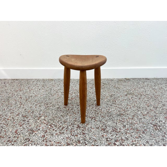 Vintage studio crafted three leg stool in oak with exposed mortise and tenon joints. A curved seat provides a comfortable...