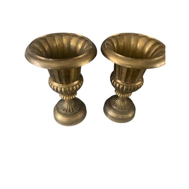 Large set of brass urns with neoclassical style. May be used as vases or planters. Heavy and nice patina.