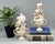 Striking pair of modern artist-made shell topiary sculptures, each composed from an assortment of natural seashells, sand...